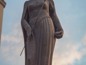 old stone statue of duchess in crown