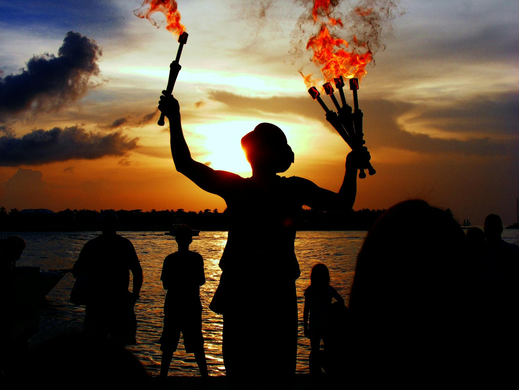 people near beach during night time