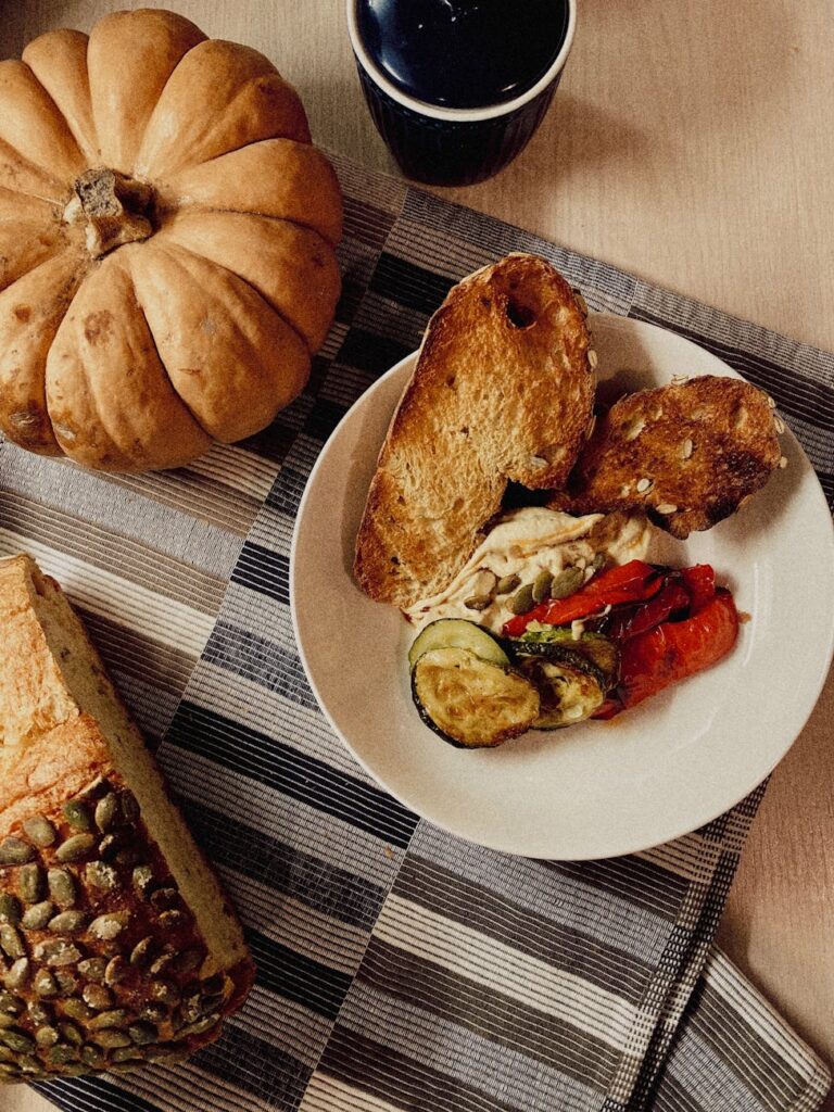 a delicious toasted breads with slices of vegetables and cream cheese