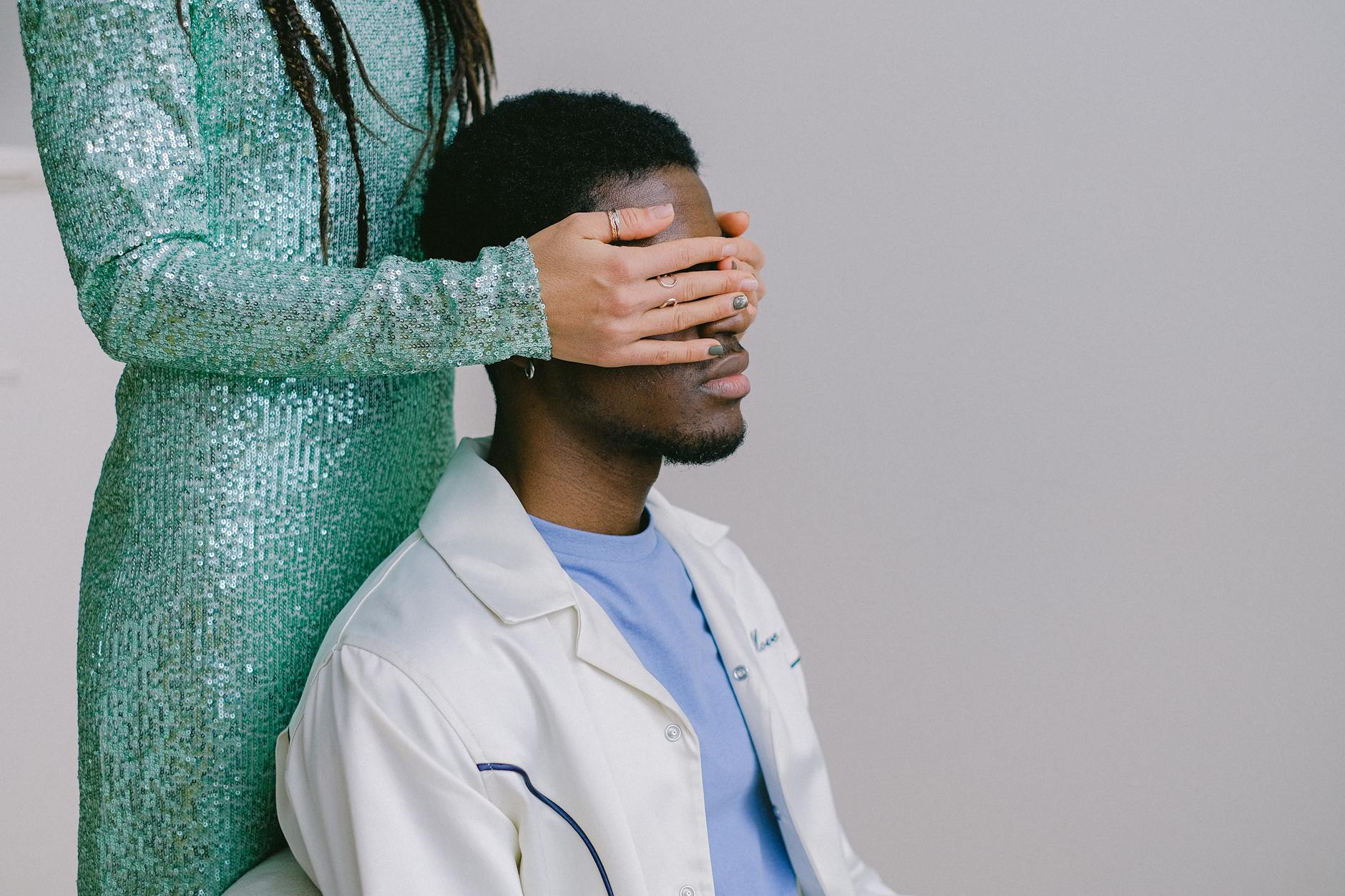 a woman covering her partner s eyes