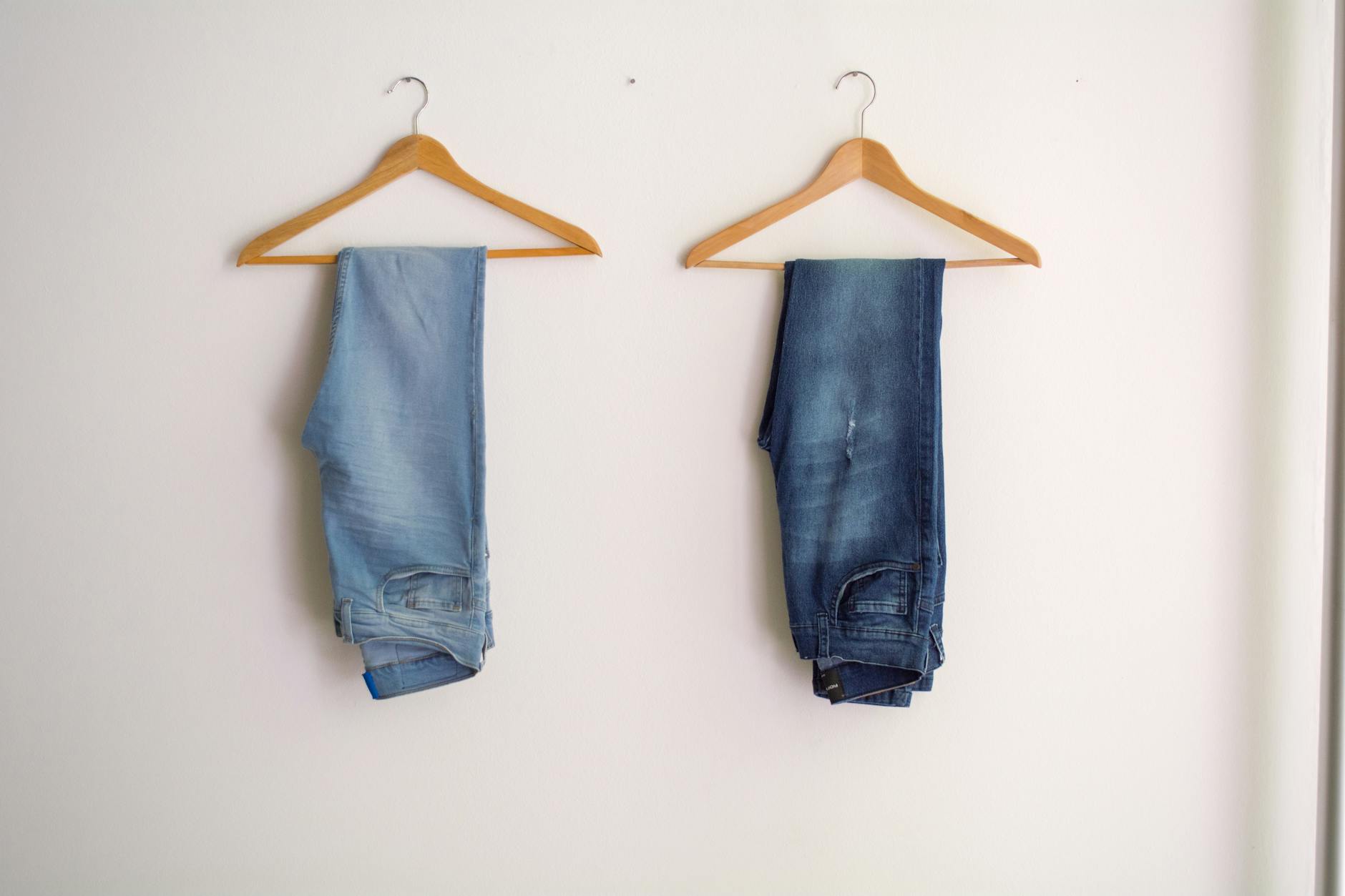 two hanged blue stonewash and blue jeans
