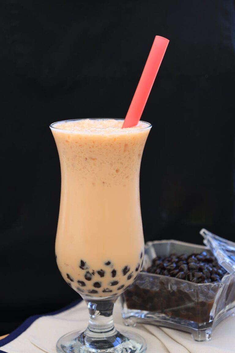 fruit shake with tapioca pearls on tall glass