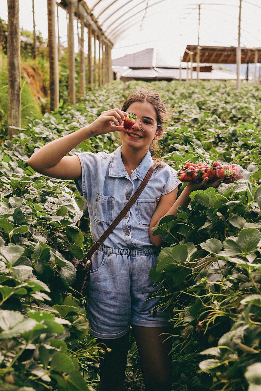happy girl with strawberries