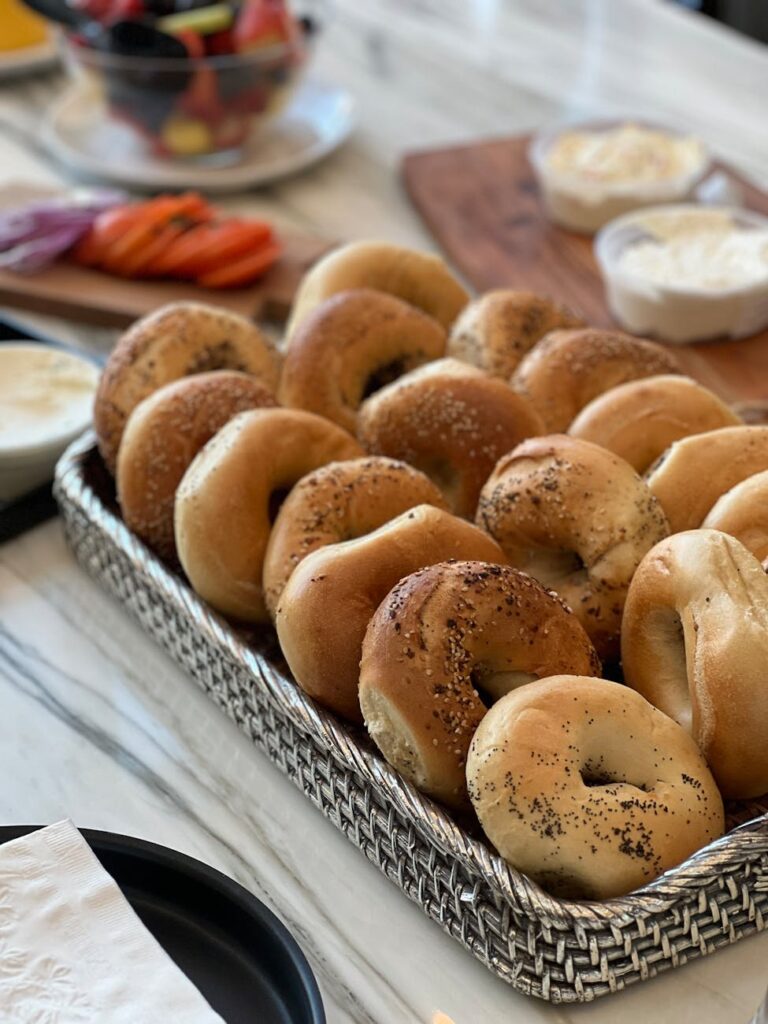 close up of fresh bagels on a tray