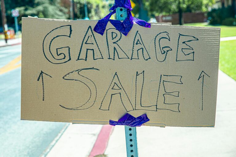 garage sale placard on a post