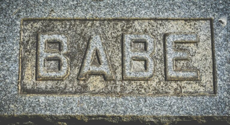 inscription babe on gray stone block