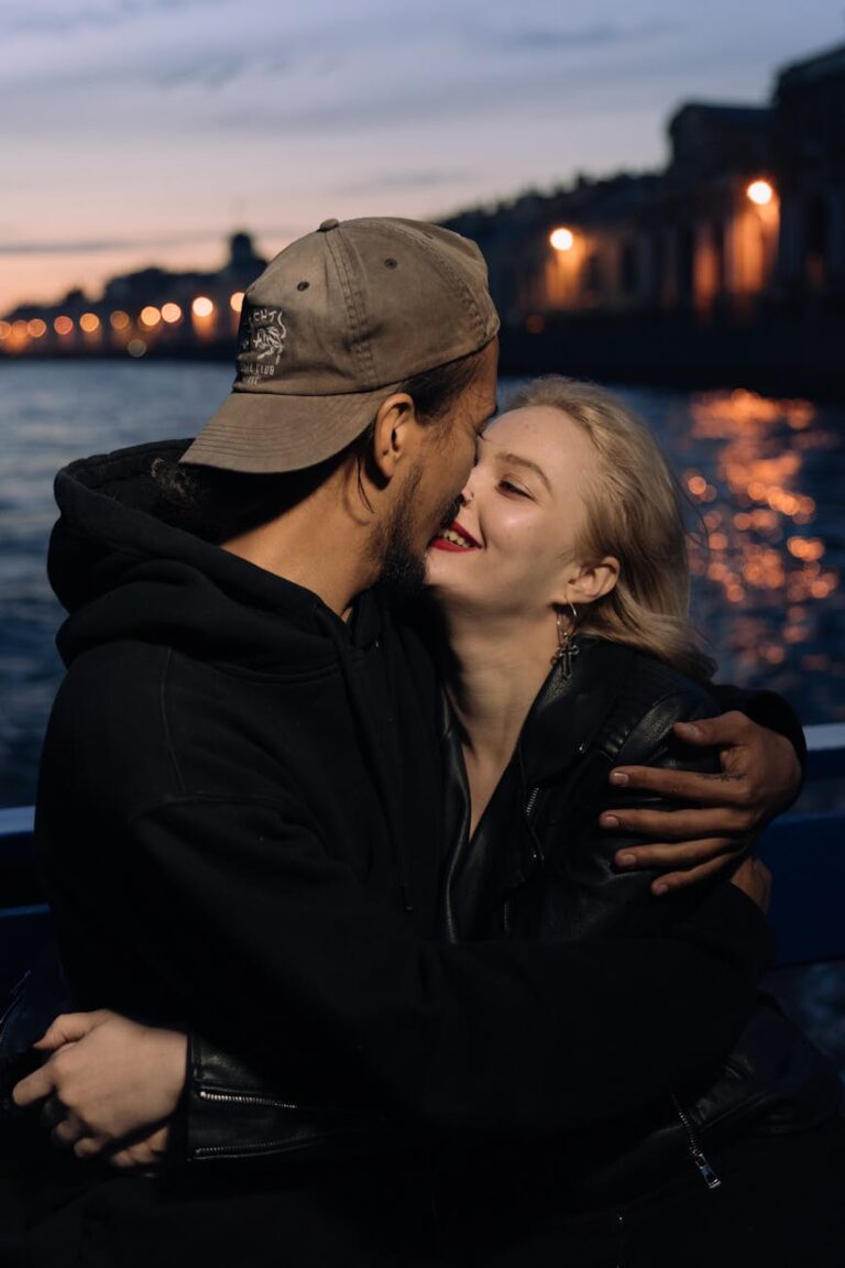 man and woman wearing black jacket and gray cap