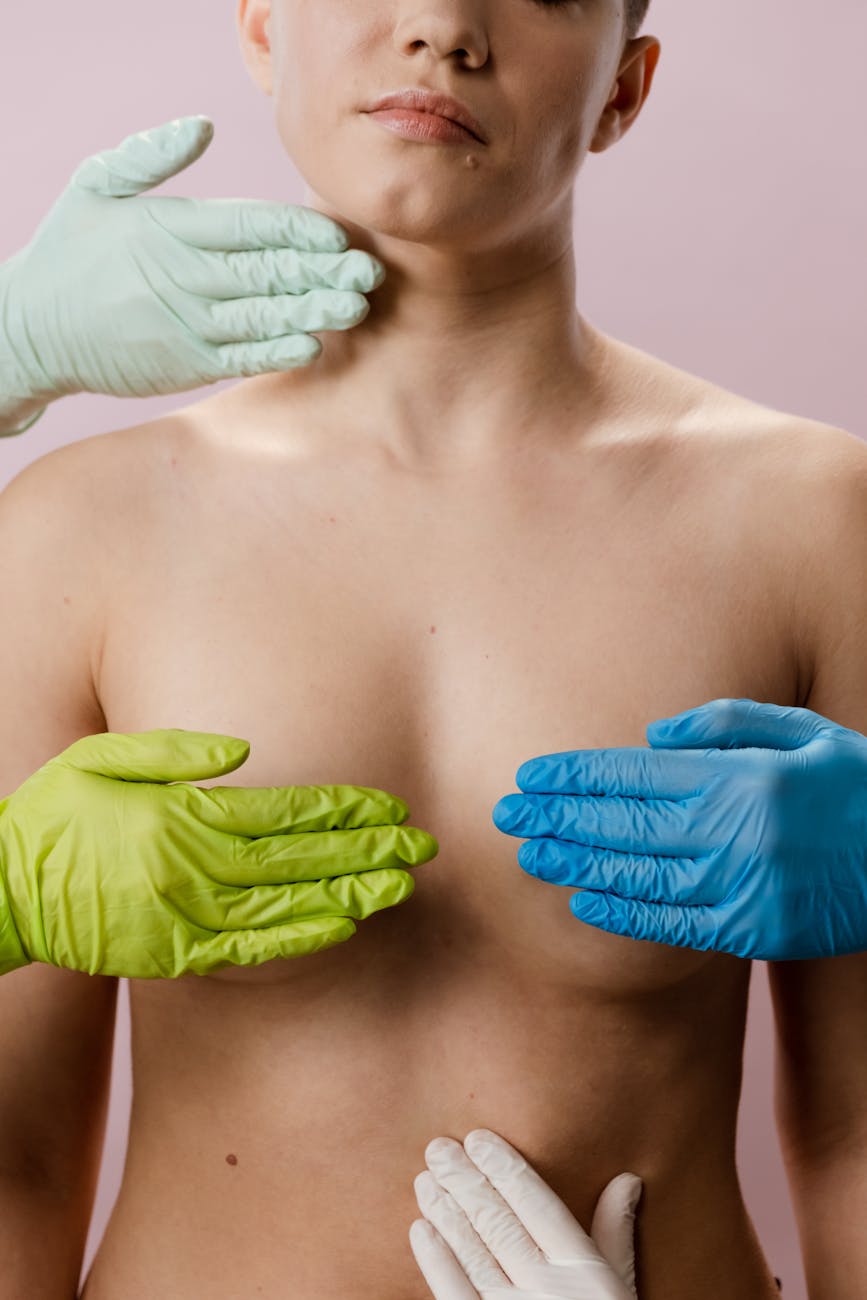 woman with blue manicure holding green leaf