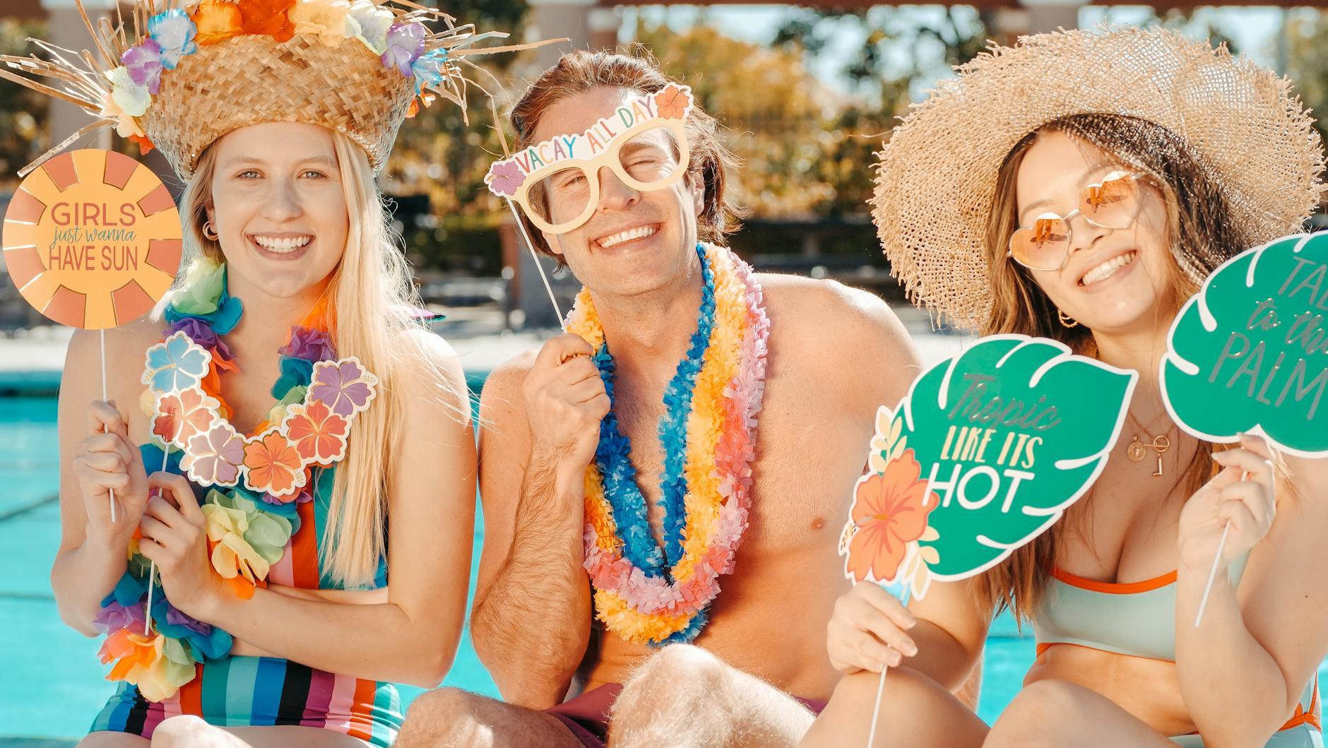 people smiling on the poolside