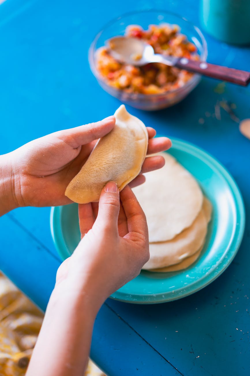 a woman holding a dough