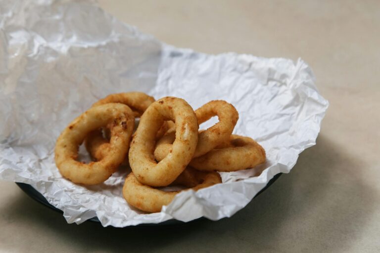 close up photograph of fried onion rings