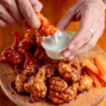 fried chickens served on wooden tray