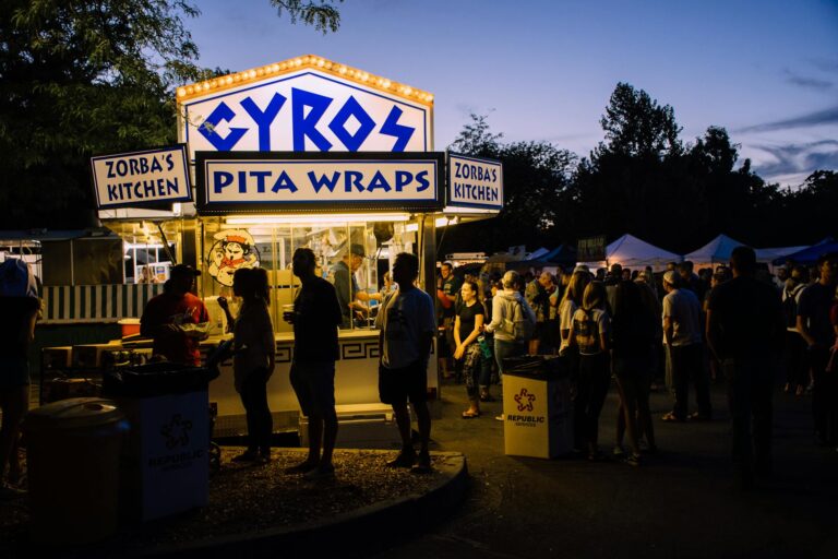 group of people near gyros pita wraps food stall