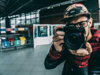 man holding dslr camera