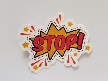 red and yellow stop sticker