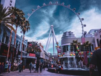 people walking on amusement park near buildings