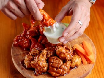 fried chickens served on wooden tray