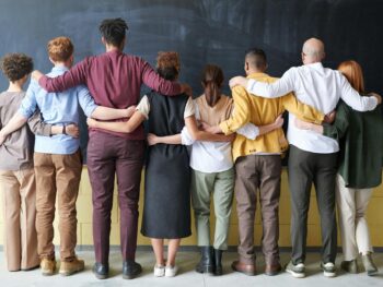 group of people standing indoors