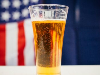 refreshing glass of beer with american flag