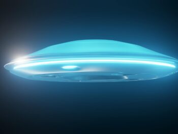 glowing with blue light flying saucer