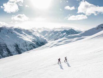 two man hiking on snow mountain