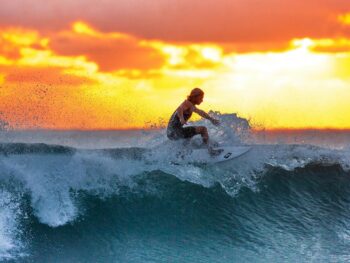 man surfing on waves